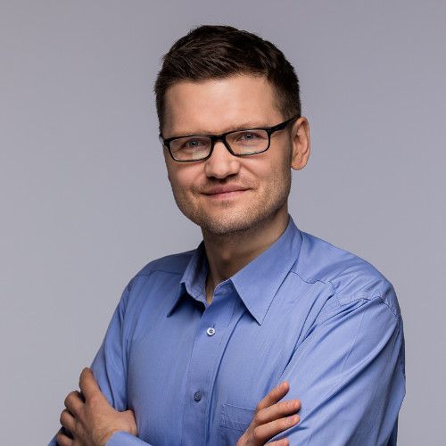 Person Standing on Top of Building